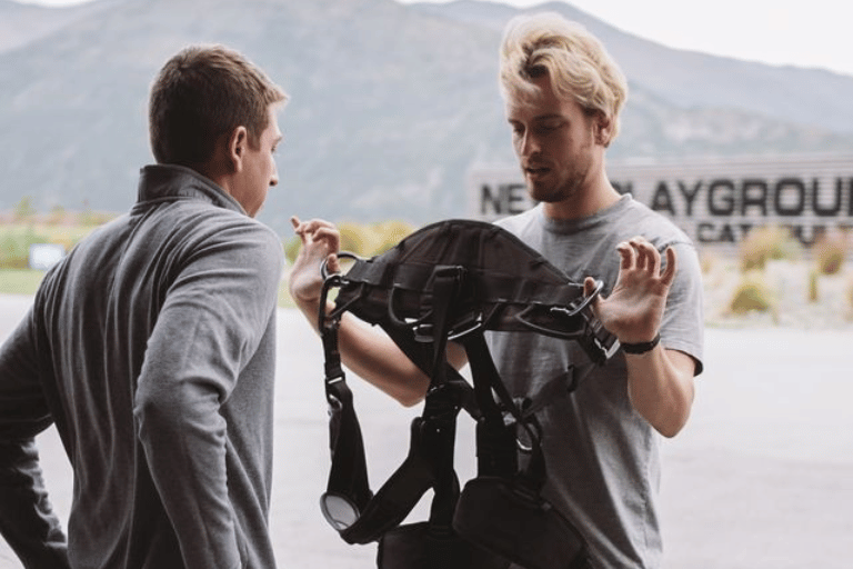 crew inspecting a bungy harness